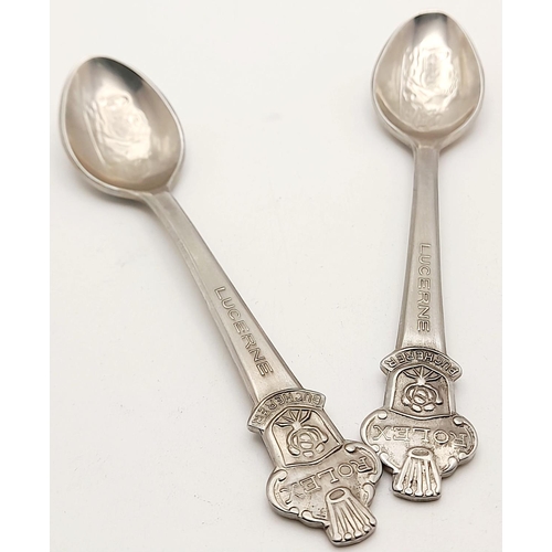 1417 - A pair of small metal teaspoons made for Bucherer of Lucerne Switzerland. 11cm in length. See photos... 