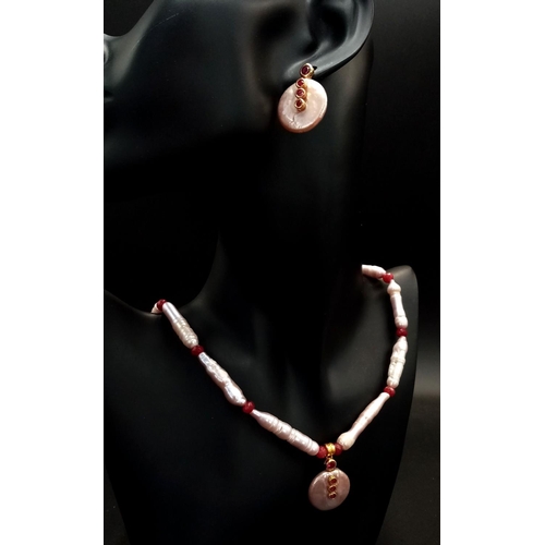 157 - A fine, large elongate pearls with round flat pearl accents and adorned with rubies necklace and ear... 