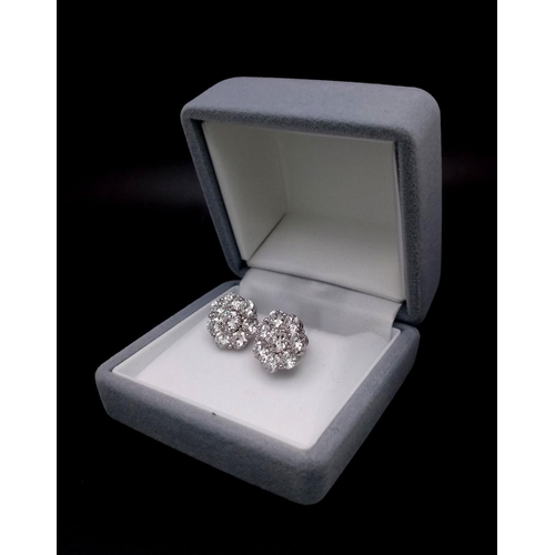 170 - A Stunning Pair of 900 Platinum Diamond Earrings. 5.74ctw of brilliant round cut VS2 diamonds in flo... 