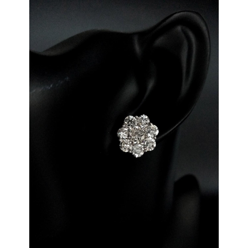 170 - A Stunning Pair of 900 Platinum Diamond Earrings. 5.74ctw of brilliant round cut VS2 diamonds in flo... 