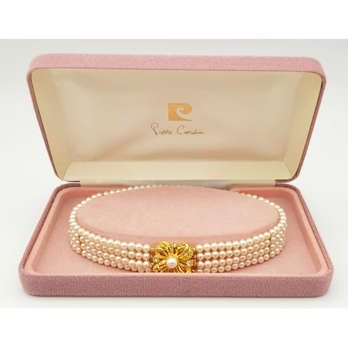 178 - A vintage PIERRE CARDIN four strand simulated pearl choker necklace with a glamorous gold-plated cla... 