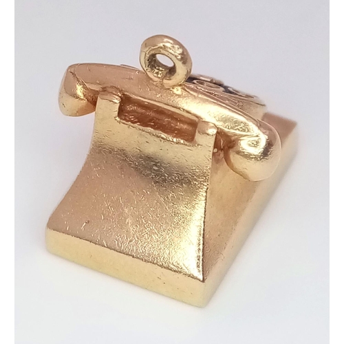 211 - A 14K Yellow Gold Dial Telephone Pendant/Charm. 4g weight. 15mm