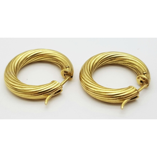 233 - A Pair of 9K Yellow Gold Creole Hoop Earrings. 2.5cm diameter. 4.4g weight.