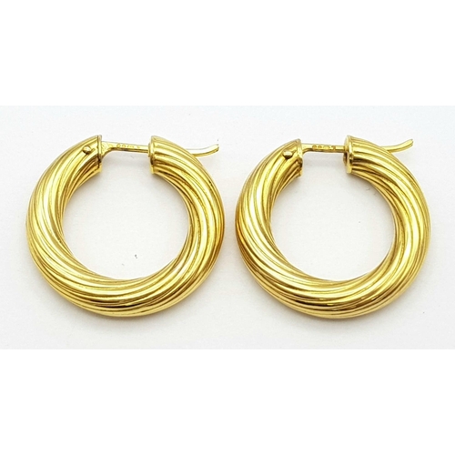 233 - A Pair of 9K Yellow Gold Creole Hoop Earrings. 2.5cm diameter. 4.4g weight.