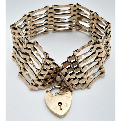 255 - A Vintage 9K Yellow Gold Gate Bracelet with Heart Clasp and Safety Chain. 18cm. 18.56g