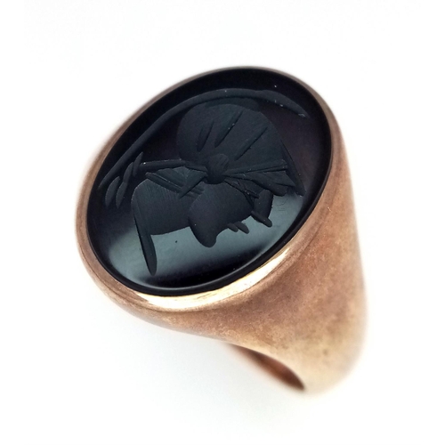 262 - A Vintage 9K Yellow Gold Signet Ring with Black Onyx Intaglio Decoration. Size T. 8.3g total weight.