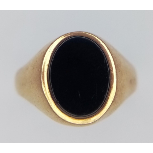 289 - A 9K Yellow Gold Black Onyx Signet Ring. Size K. 2.2g total weight.