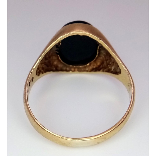 289 - A 9K Yellow Gold Black Onyx Signet Ring. Size K. 2.2g total weight.