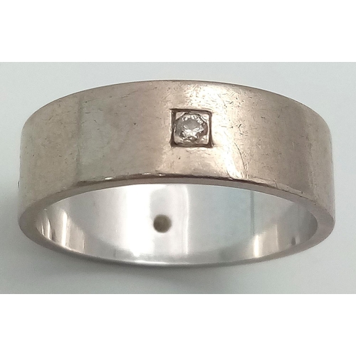 359 - An 18K White Gold Diamond Band Ring. Size O. 6.56g total weight.