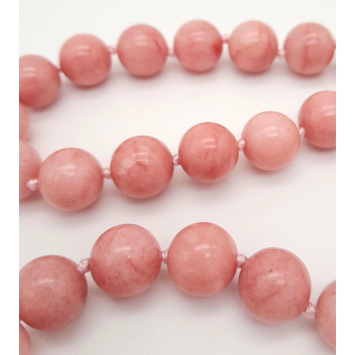 380 - A Luscious Pink Rhodochrosite Beaded Necklace with a Baroque Pearl Interrupter and Glitterball Clasp... 