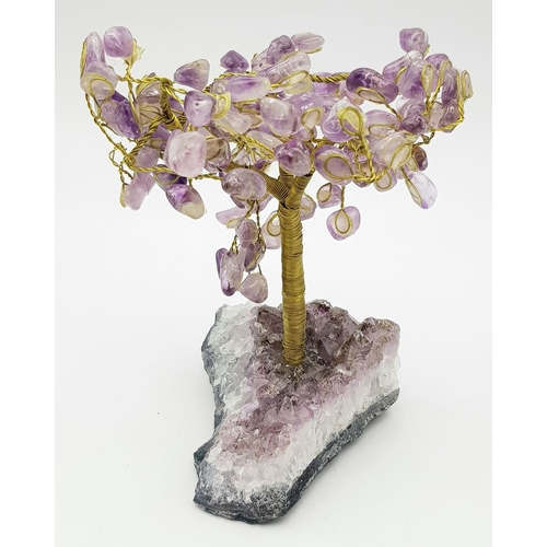 400 - A Beautiful Amethyst Tree. An amethyst cluster base with a yellow metal tree decorated with polished... 