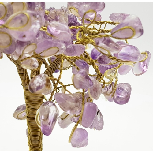 400 - A Beautiful Amethyst Tree. An amethyst cluster base with a yellow metal tree decorated with polished... 