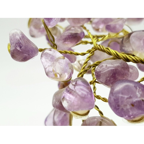 400 - A Beautiful Amethyst Tree. An amethyst cluster base with a yellow metal tree decorated with polished... 