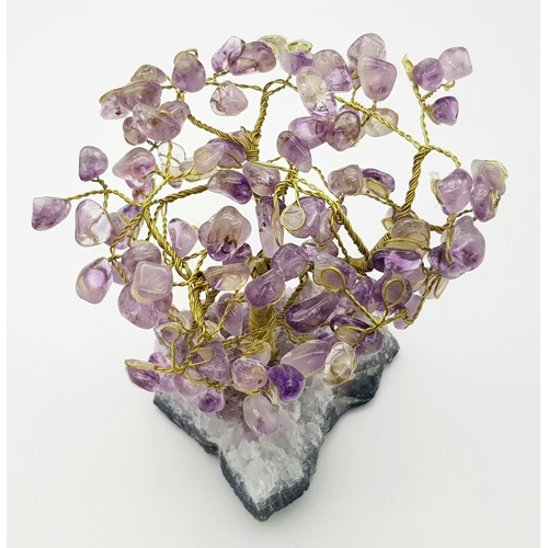 400 - A Beautiful Amethyst Tree. An amethyst cluster base with a yellow metal tree decorated with polished... 