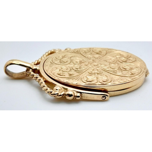 8 - A 9K yellow Gold Spinning Locket Fob Style Pendant. Engraved decoration. 4cm. 8.2g total weight.