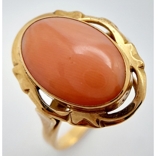 86 - A Beautiful Vintage 18K Yellow Gold Pink Coral Ring. Pastel coloured coral cabochon. Size P. 4.1g to... 