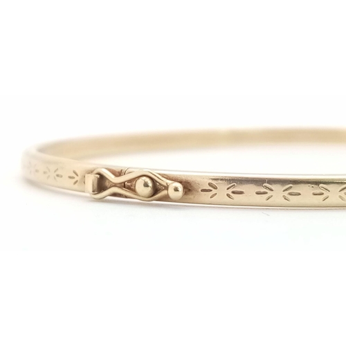 15 - A Vintage 9K Yellow Gold Clip Bangle. 6cm inner diameter. 3.5g total weight.