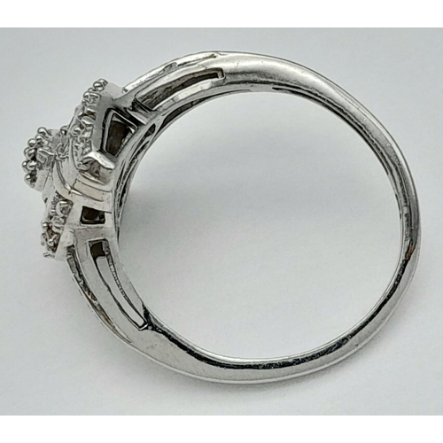 669 - An Art Deco Design Sterling Silver Diamond Set Cluster Ring Size O. Crown Measures 1.6cm length. Set... 