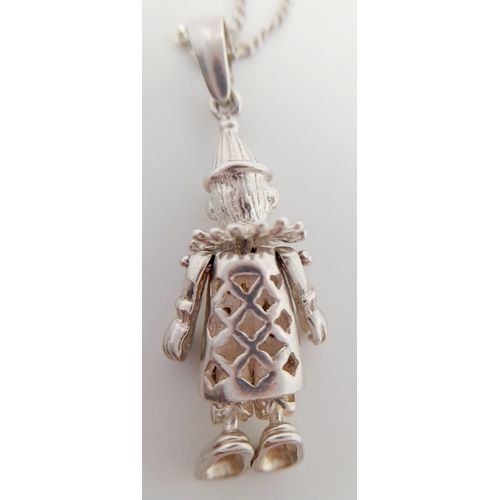 1654 - A 925 Articulated Clown Pendant on a Silver Chain. 3.5cm and 42cm.