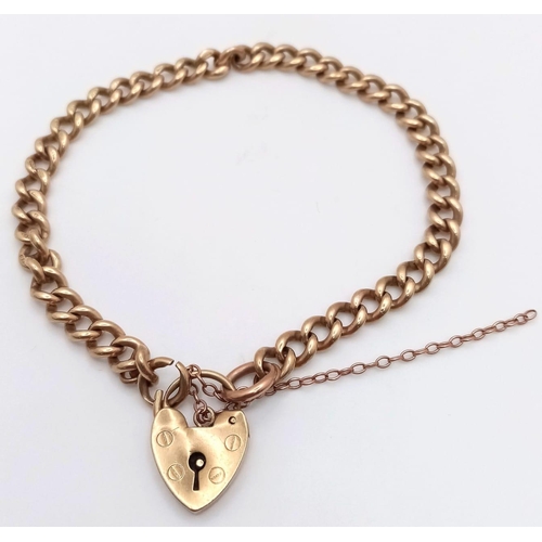1220 - A Vintage 9K Yellow Gold Curb Link Bracelet with Heart Clasp. 20cm. 15.7g weight.