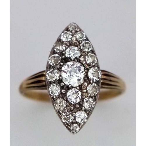 207 - A Vintage 18K Yellow Gold (tested) Marquise Shape Diamond Ring. 19 different sized round cut diamond... 