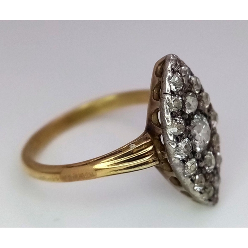 207 - A Vintage 18K Yellow Gold (tested) Marquise Shape Diamond Ring. 19 different sized round cut diamond... 