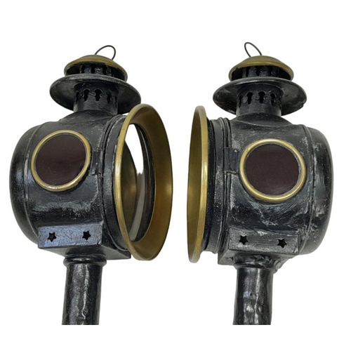 216 - A Pair of Antique Coach Lamps. Decorative brass and leather.
45cm.