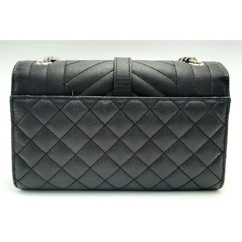 118 - A Saint Laurent Black Envelope Crossbody Bag. Quilted leather exterior with silver-toned hardware, c... 