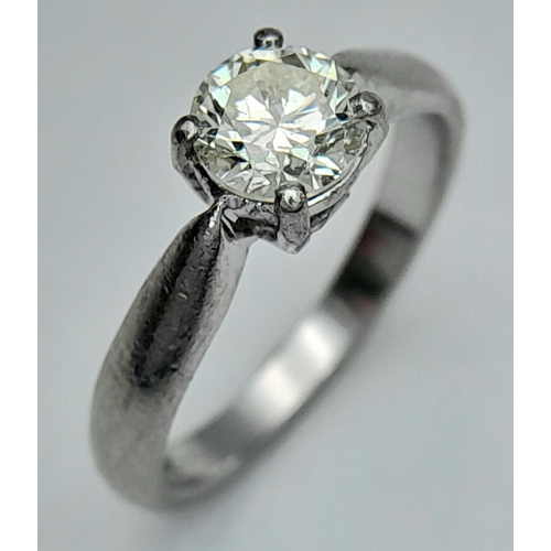 144 - A 950 Platinum Diamond Solitaire Ring. Size K 1/2. 0.72ct tinted diamond. 4.85g total weight. Ref: 1... 