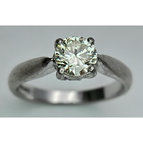 144 - A 950 Platinum Diamond Solitaire Ring. Size K 1/2. 0.72ct tinted diamond. 4.85g total weight. Ref: 1... 