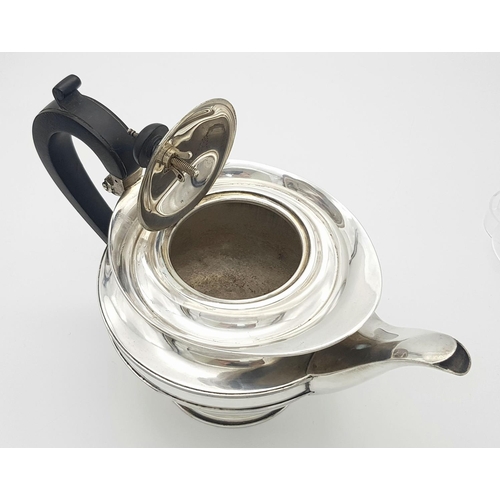 94 - A Vintage (1938) Sterlng Silver Teapot. Genie-Lamp-Esque  design with Bakelite handle. 24cm handle -... 