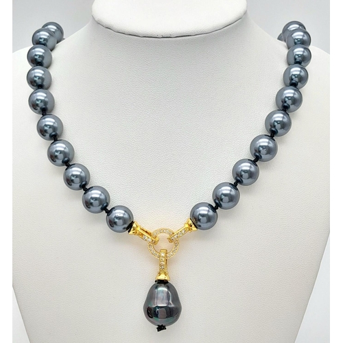 1660 - A Metallic Blue/Grey South Sea Pearl Shell Necklace with Hanging Pendant. Necklace -50cm. Pendant - ... 