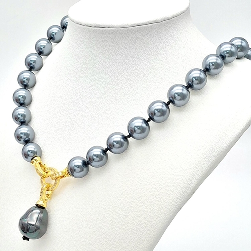 1660 - A Metallic Blue/Grey South Sea Pearl Shell Necklace with Hanging Pendant. Necklace -50cm. Pendant - ... 