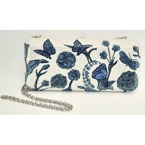 172 - A Judith Leiber Blue Garden Clutch Bag. Crystal embellished exterior with clasp fastening closure. S... 