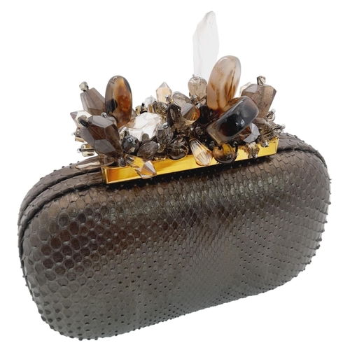 179 - A Madiso Brown Clutch Bag. Python skin exterior with stone embellish clasp fastening closure. Silver... 