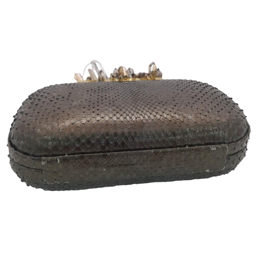 179 - A Madiso Brown Clutch Bag. Python skin exterior with stone embellish clasp fastening closure. Silver... 