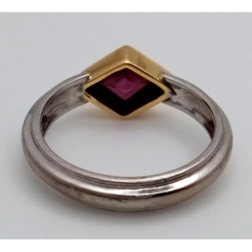 200 - An 18K White and Yellow Gold Ruby Ring. A rhombus shaped cut ruby. Size O 1/2. 5.3g total weight. 1c... 