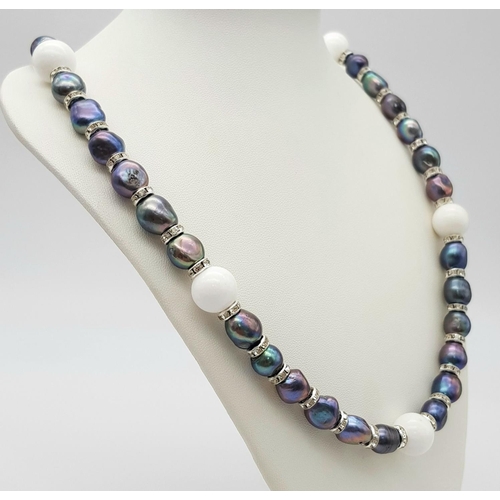 220 - A Tahitian, metallic grey genuine pearl necklace and earrings set, highlighted with pure white jade ... 