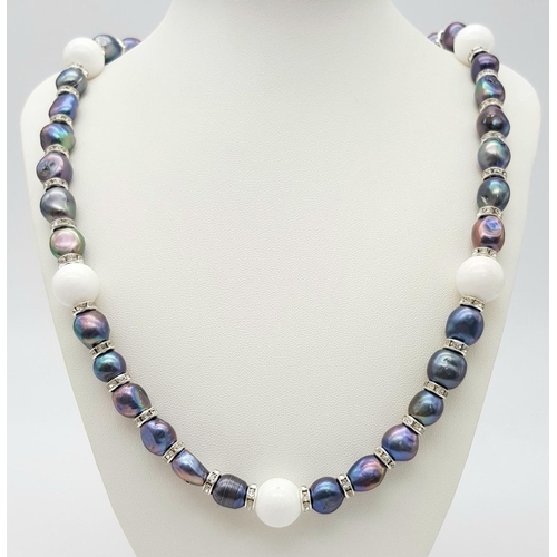 220 - A Tahitian, metallic grey genuine pearl necklace and earrings set, highlighted with pure white jade ... 