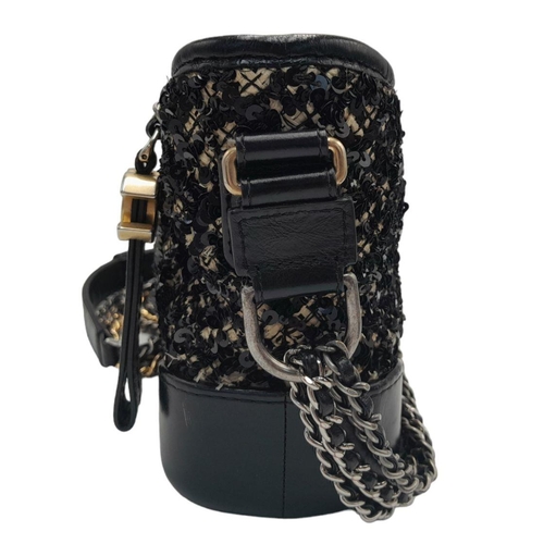 3 - A Chanel Black and Cream Sequin Gabrielle Bag. Leather, textile and sequin exterior with silver and ... 