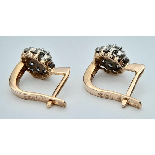 33 - 14K ROSE GOLD DIAMOND STUD EARRINGS 0.70CT 3.1G

ref: PERS 3004