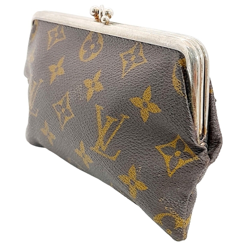 444 - A Vintage Louis Vuitton Coin Purse. Louis Vuitton x Saks Fifth Avenue collaboration. Monogram canvas... 