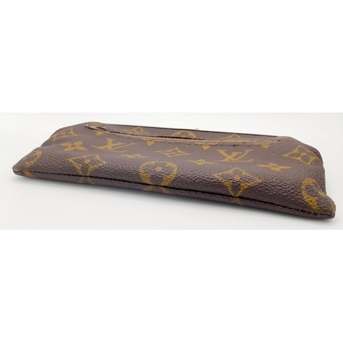 444 - A Vintage Louis Vuitton Coin Purse. Louis Vuitton x Saks Fifth Avenue collaboration. Monogram canvas... 