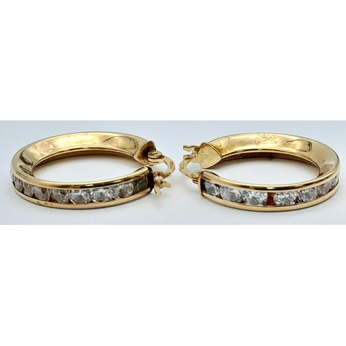 473 - 9K Yellow gold CZ Hoops, 3.4g total weight

ref: 1574I