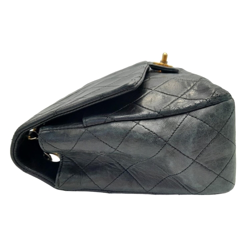 60 - A Classic Vintage Chanel Mid-Size Flap Shoulder Bag. Quilted leather exterior with gold-tone hardwar... 