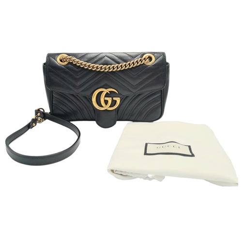 88 - A Gucci Black Marmont Flap Bag. Matelassé leather exterior with gold-toned hardware, chain and leath... 