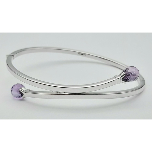 89 - 9K WHITE GOLD AMETHYST SET BANGLE 8.1G

ref: SC 3003