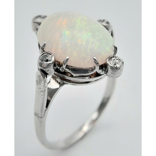 124 - 18K WHITE GOLD ( TESTED ) DIAMOND & OPAL RING 4.2G SIZE L

ref: PERS 3008
