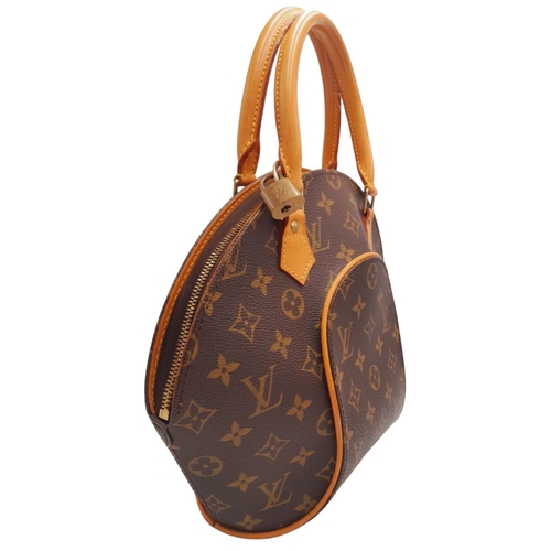 146 - A Louis Vuitton Ellipse Handbag. Monogram canvas exterior with leather trim, the iconic LV padlock, ... 