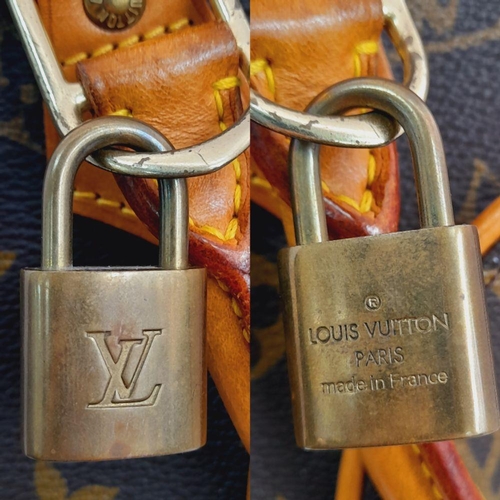 146 - A Louis Vuitton Ellipse Handbag. Monogram canvas exterior with leather trim, the iconic LV padlock, ... 